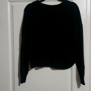 Black knitted slightly cropped sweater.
